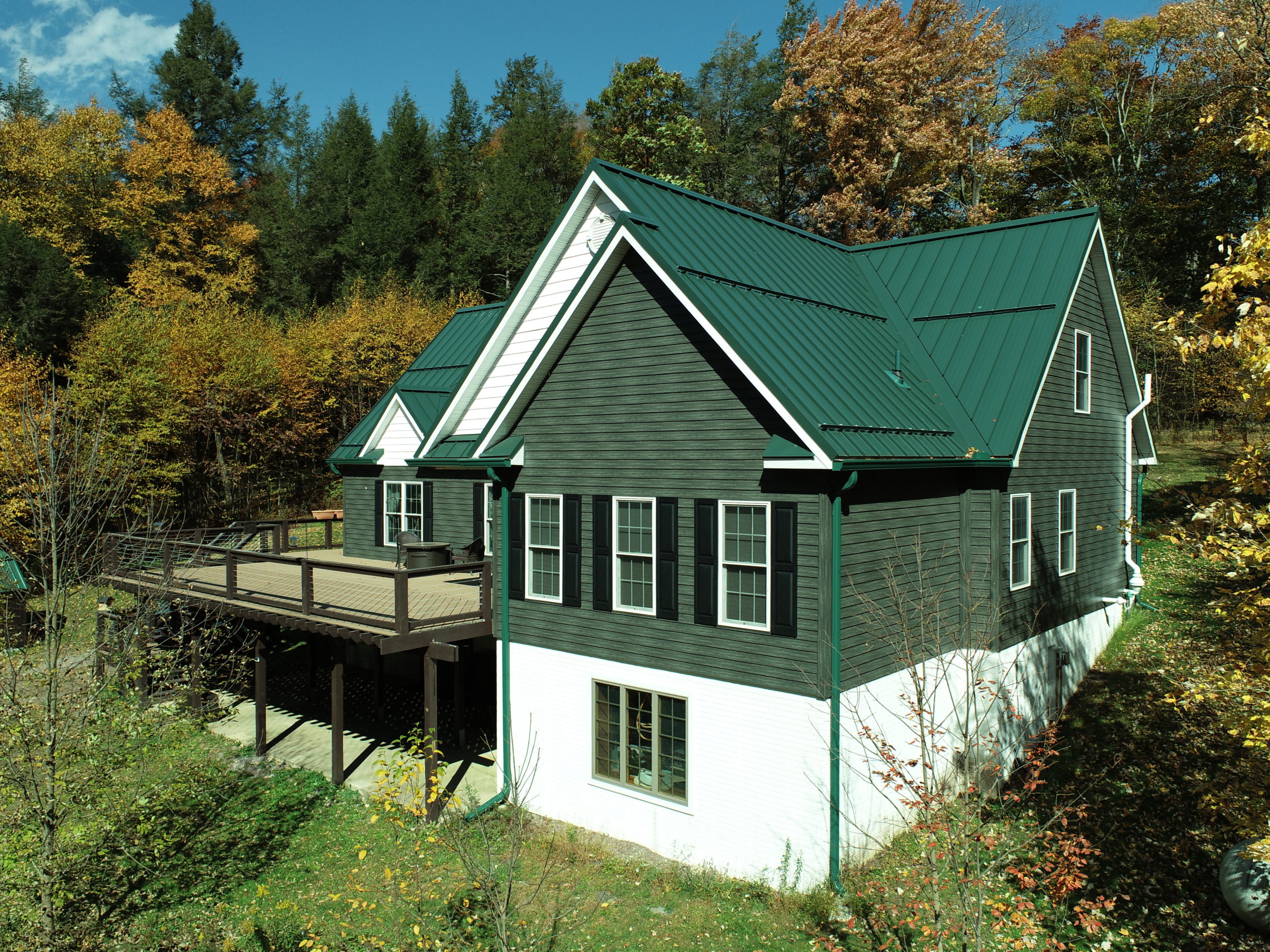 ShieldPro Metals has posts on metal roofing such as this house has on it.
